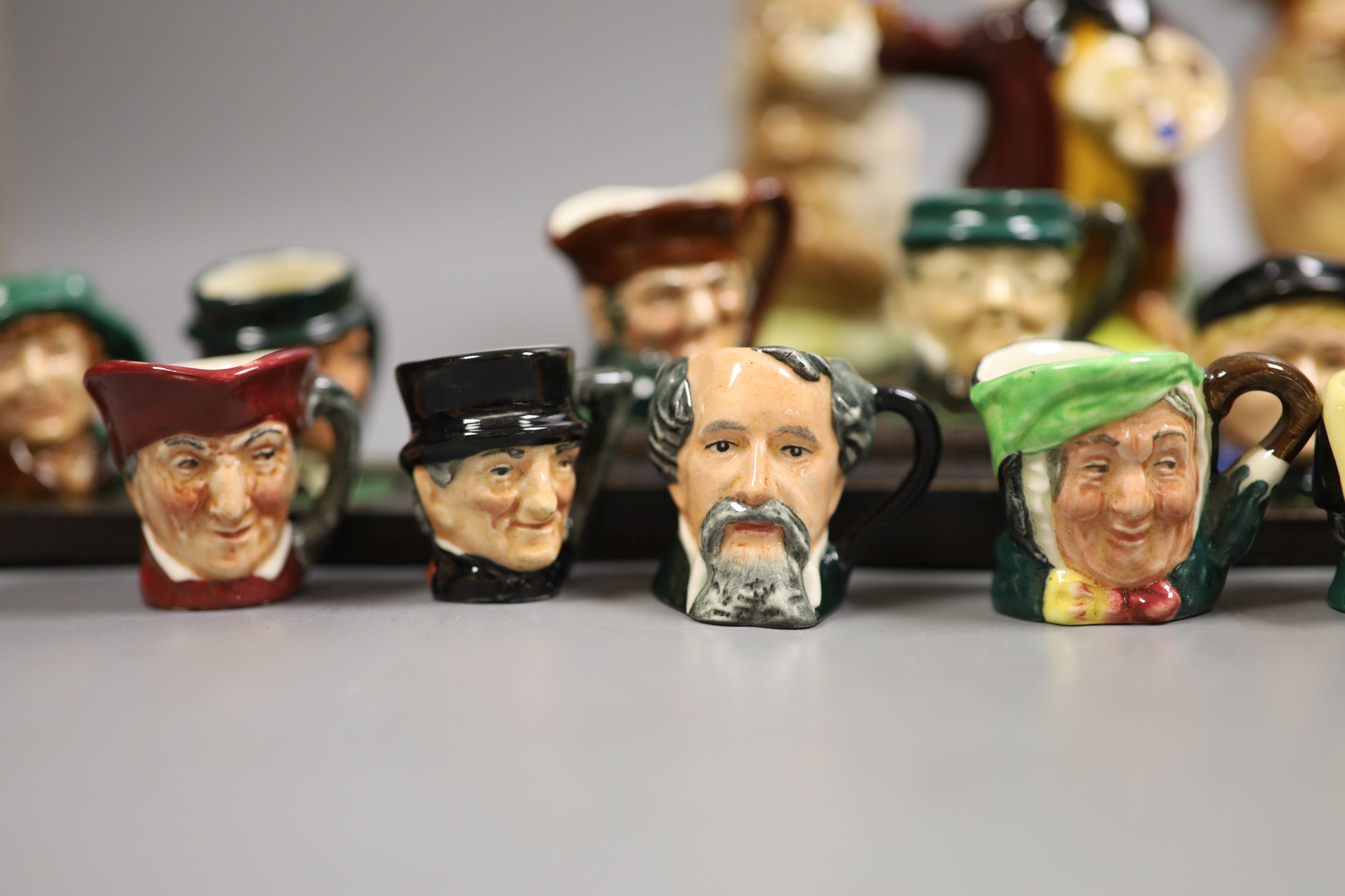 A collection of Royal Doulton miniature character mugs, figurines, series plate etc